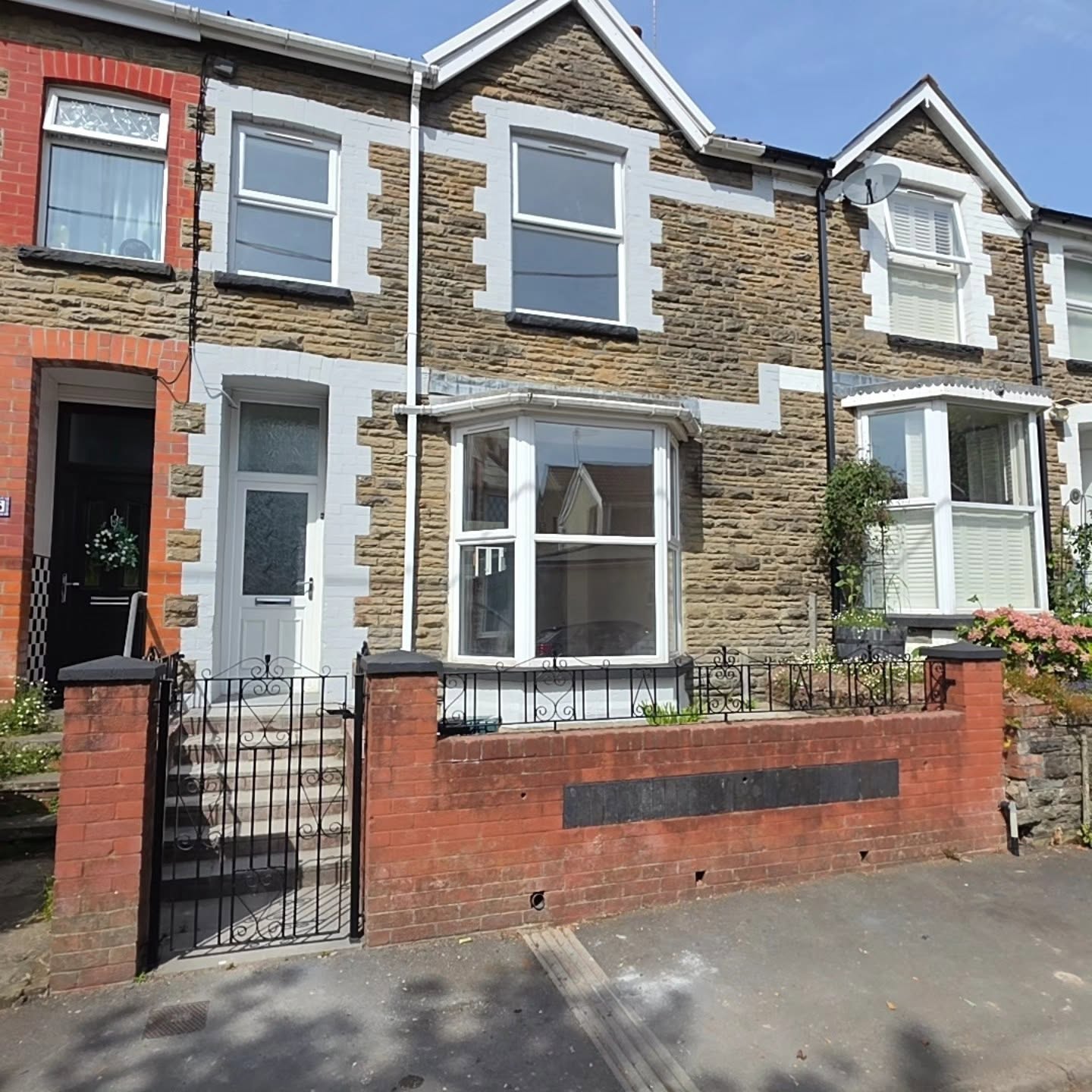 Before: the tired terraced property in Llanbradach with its old white front door