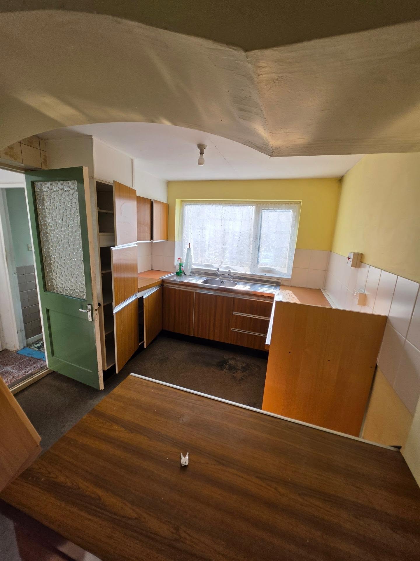 Before: the original dated kitchen prior to the open-plan renovation
